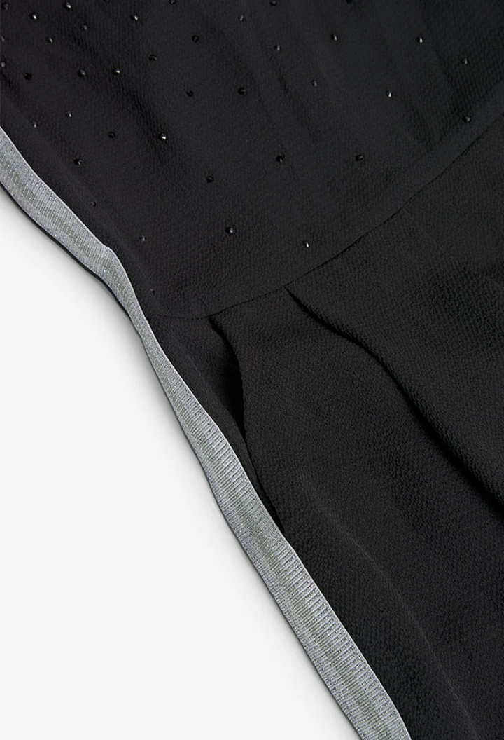 Mono crepe de niña en negro